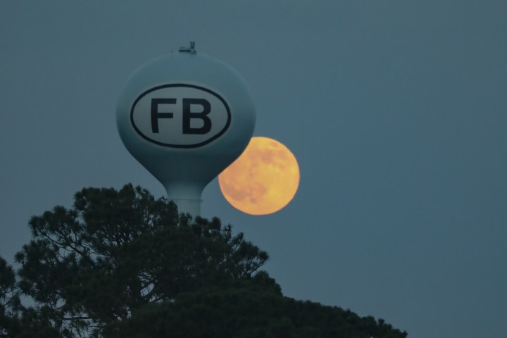 full moon over folly beach