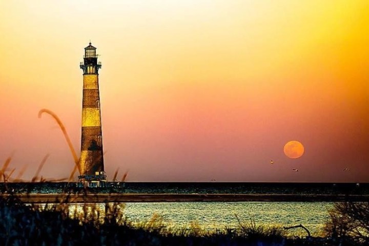 a sunset over a body of water