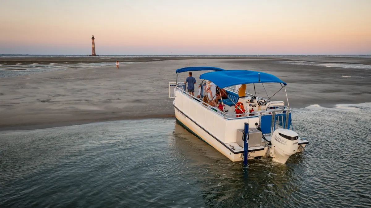 a boat on a beach near a body of water