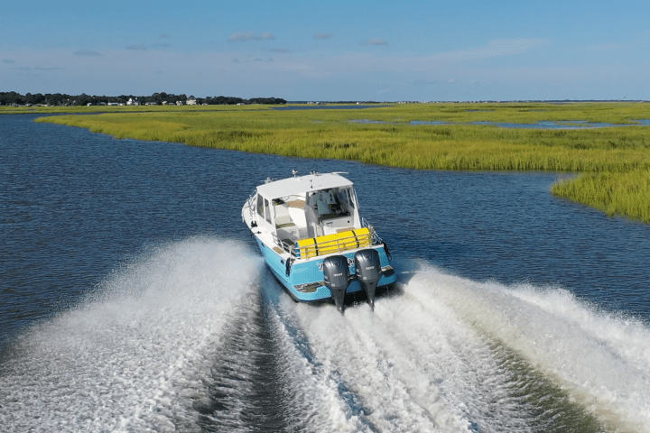 a train traveling down tracks next to a body of water