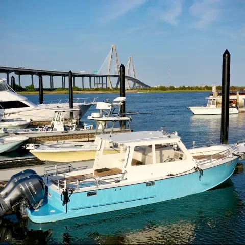 a boat is docked next to a body of water