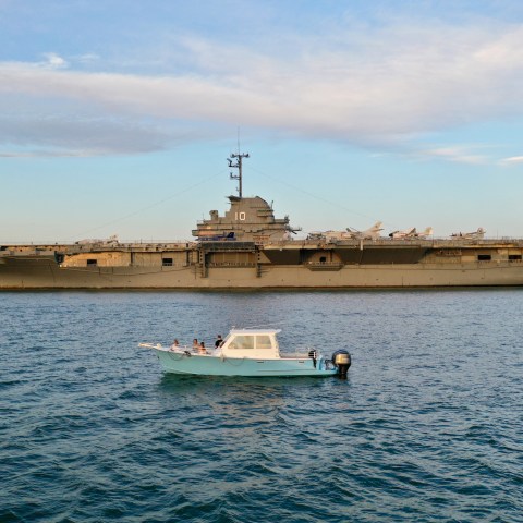a small boat in a large body of water