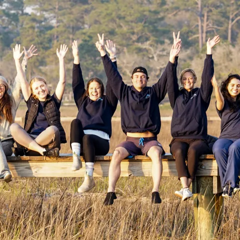a group of people jumping in the air