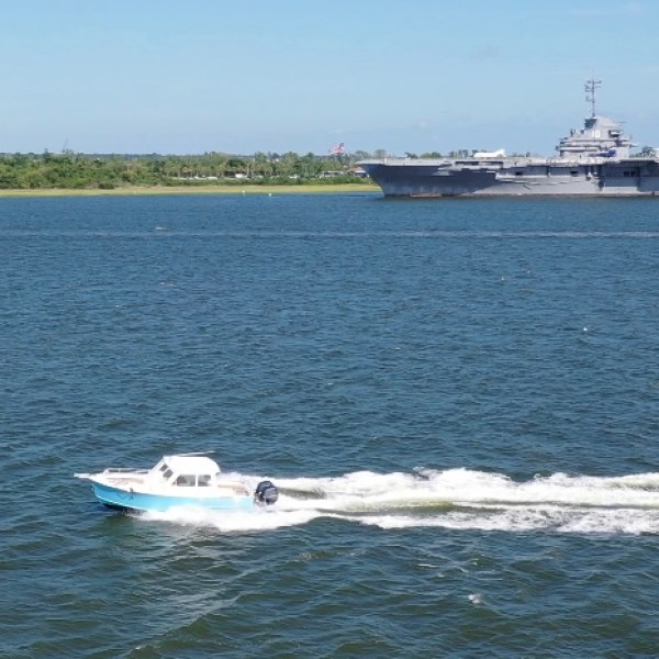 a small boat in a large body of water