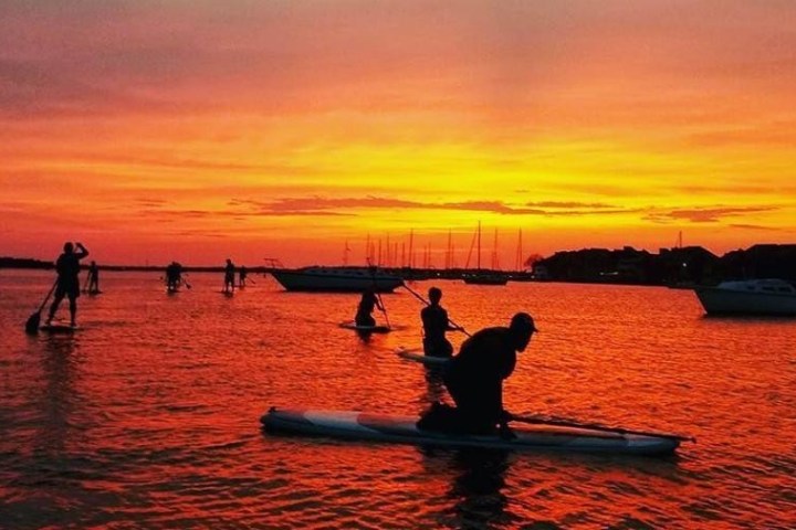 a sunset over a body of water