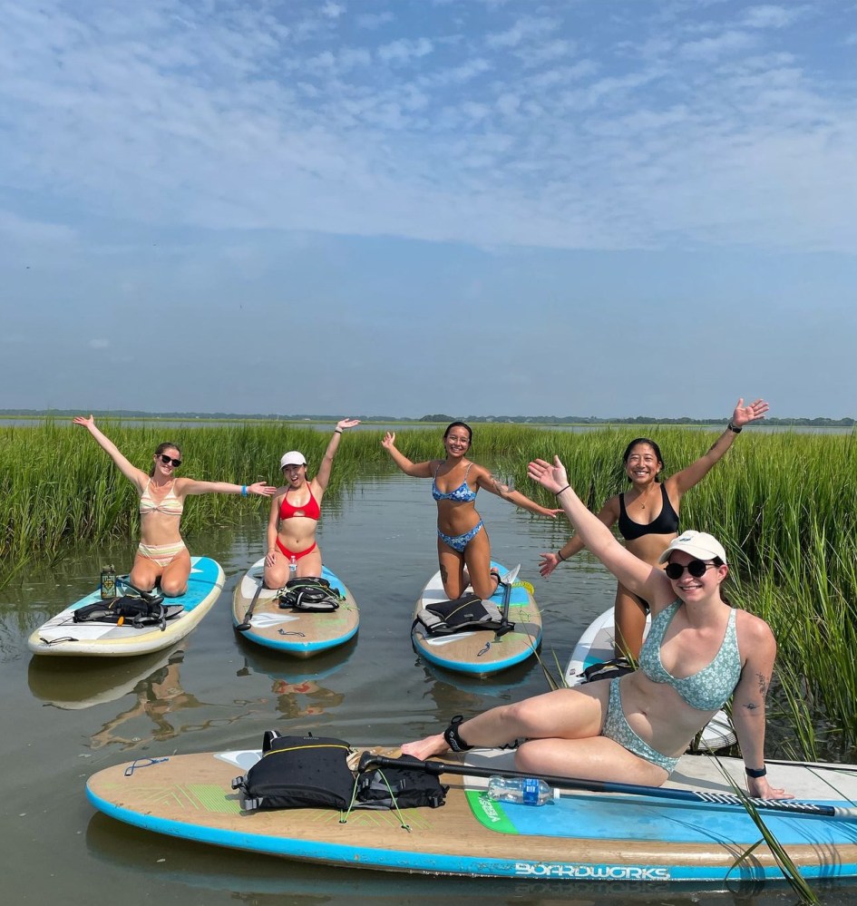 a group of people on a boat in the water