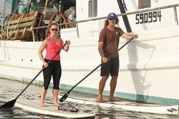 a person riding on the back of a boat